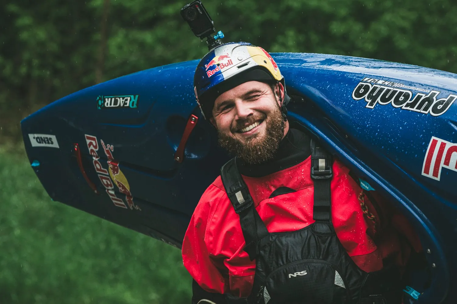 Adrian Mattern with his Pyranha kayak, Red Bull helmet and NRS gear