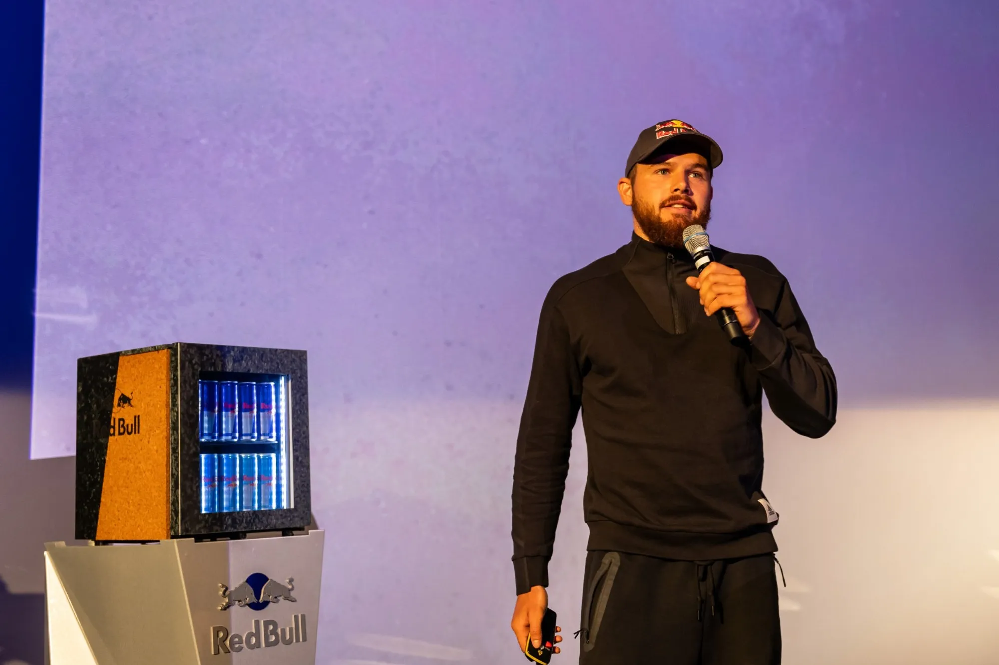 Adrian Mattern speaking at a Red Bull event