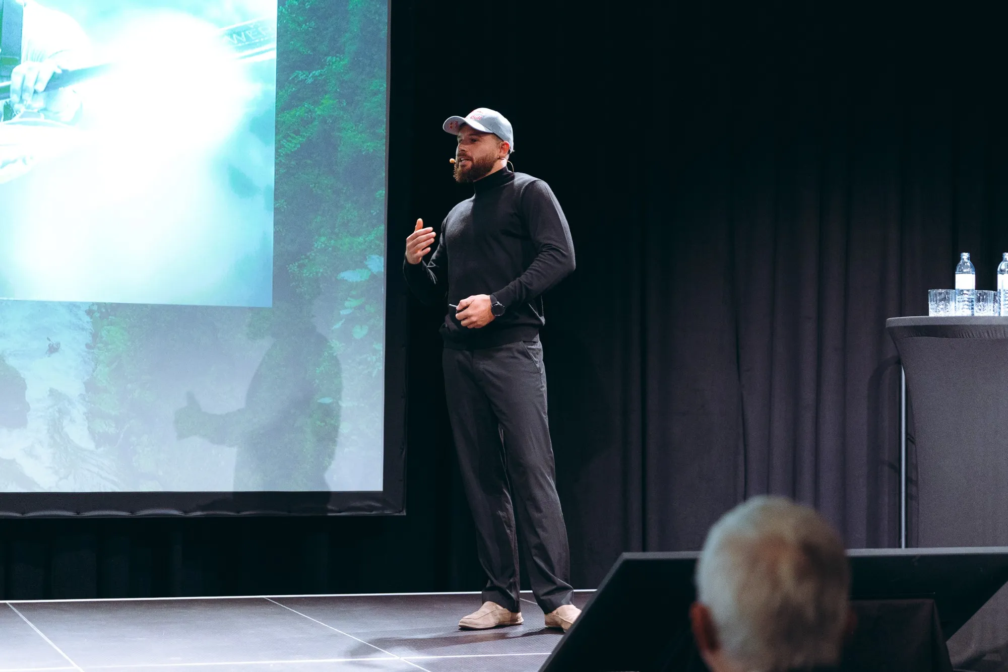 Adrian Mattern on stage during a keynote talk