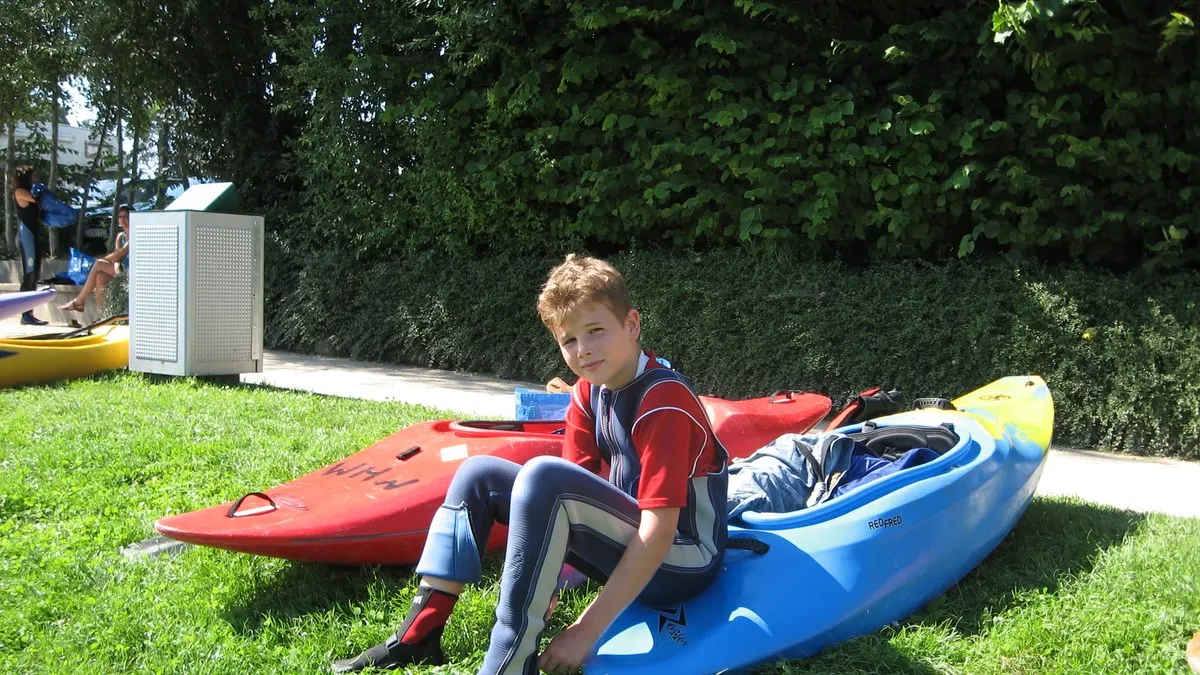 Teenage Adrian with kayaks